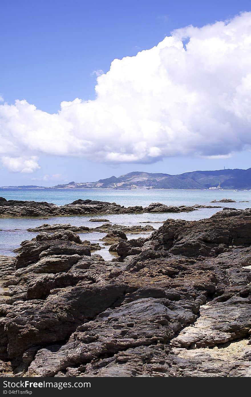 Rocks along the shoreline of an Okinawan beach. Rocks along the shoreline of an Okinawan beach.