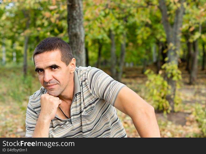 Thoughtful man with chin on hand