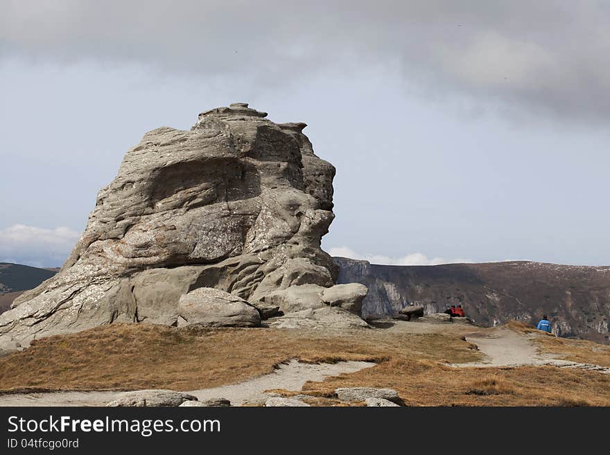 People admiring sphinx