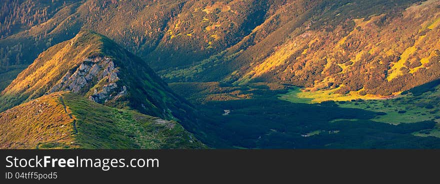 Panorama of the mountain summit. Summer evening