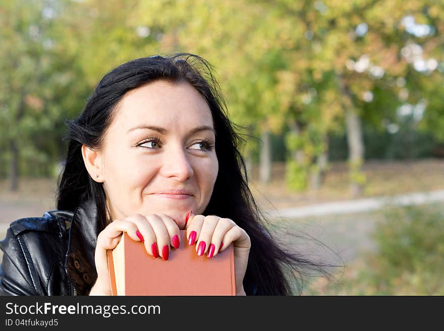 Smiling woman with a book