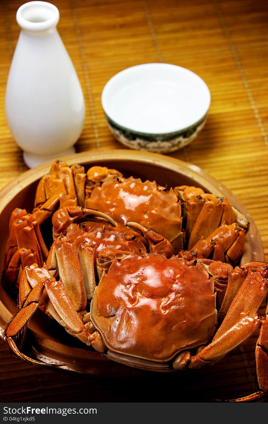 River crab and liqueur on the table.