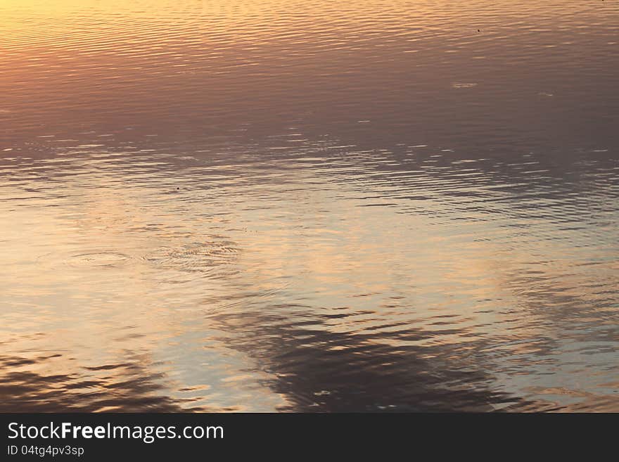 Rising sun reflected on a lake. Rising sun reflected on a lake