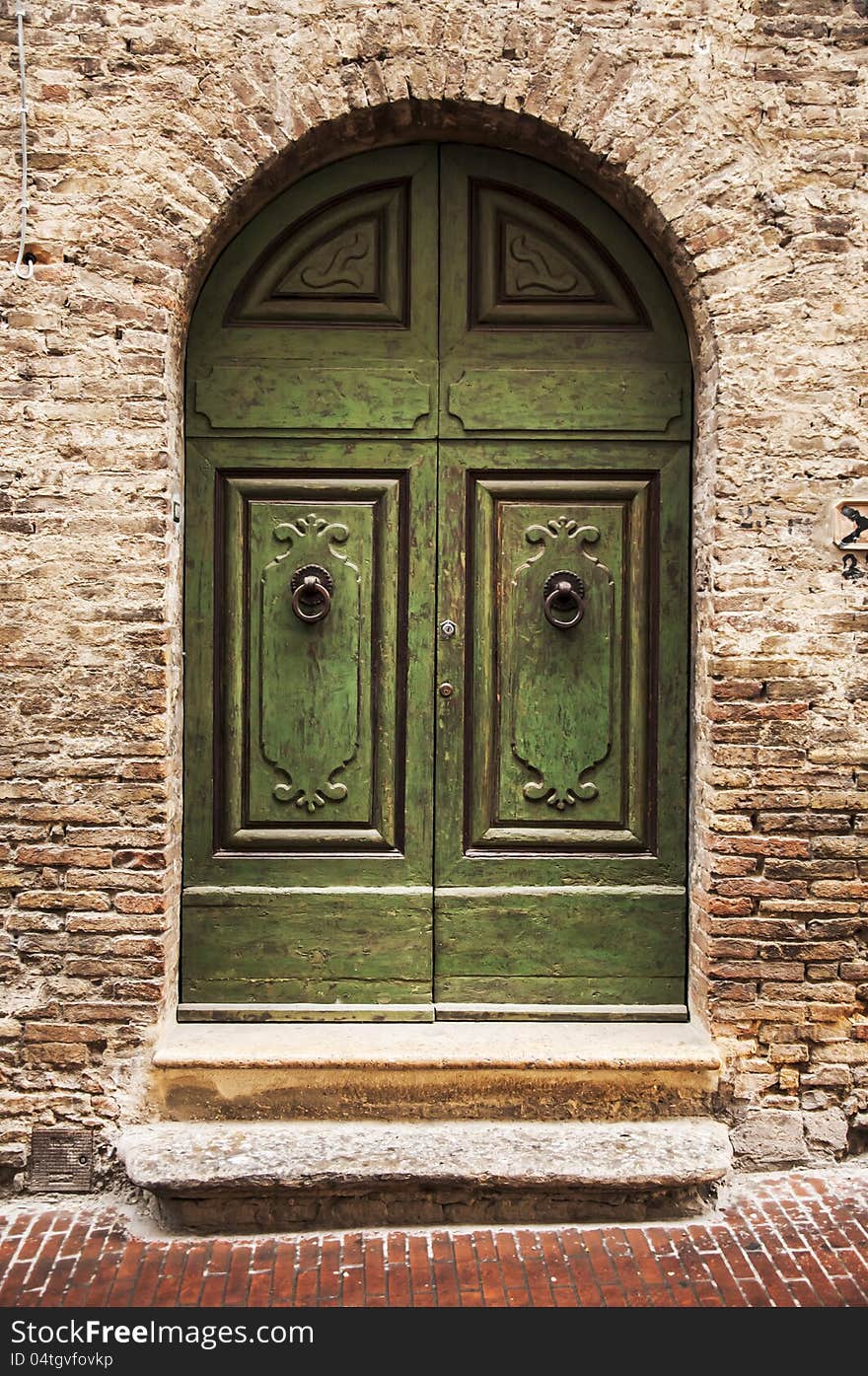 Door of the old building in italian village of tuscany, italy