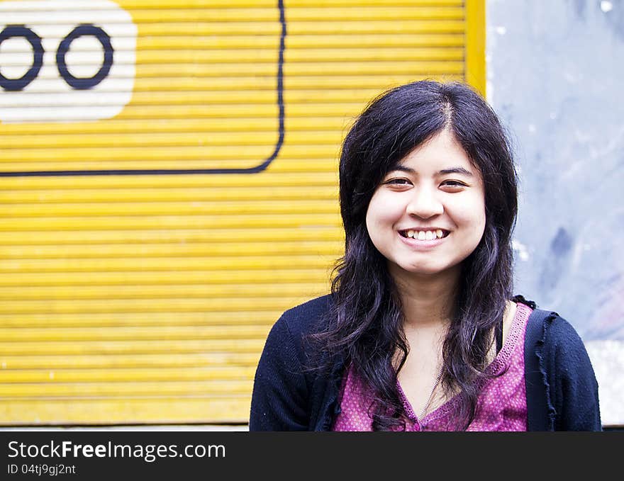 Teenage girl smiling and looking into the camera