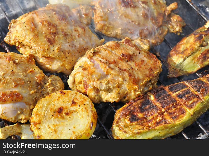 Slices of chicken with vegetables grilled at weekend in the summer. Slices of chicken with vegetables grilled at weekend in the summer