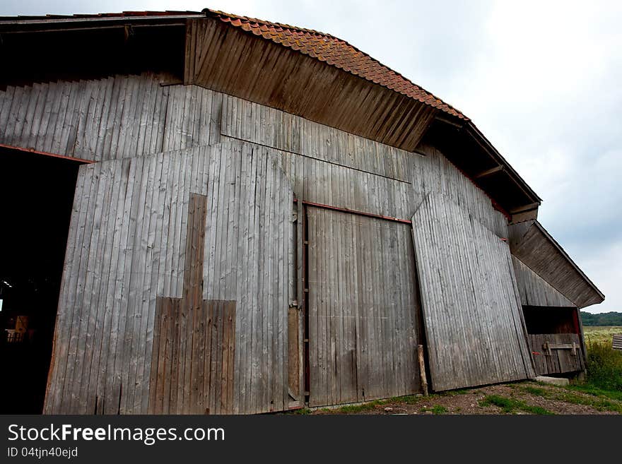 Old vintage barn in a farm agriculture background image. Old vintage barn in a farm agriculture background image