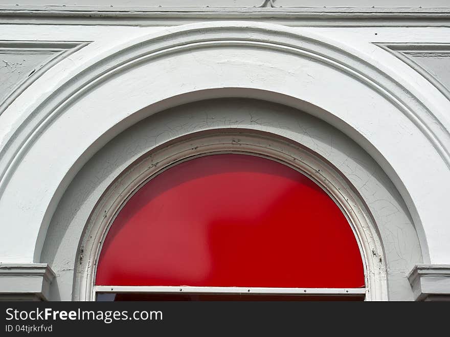 Traditional classic wooden arch door in red and white. Traditional classic wooden arch door in red and white