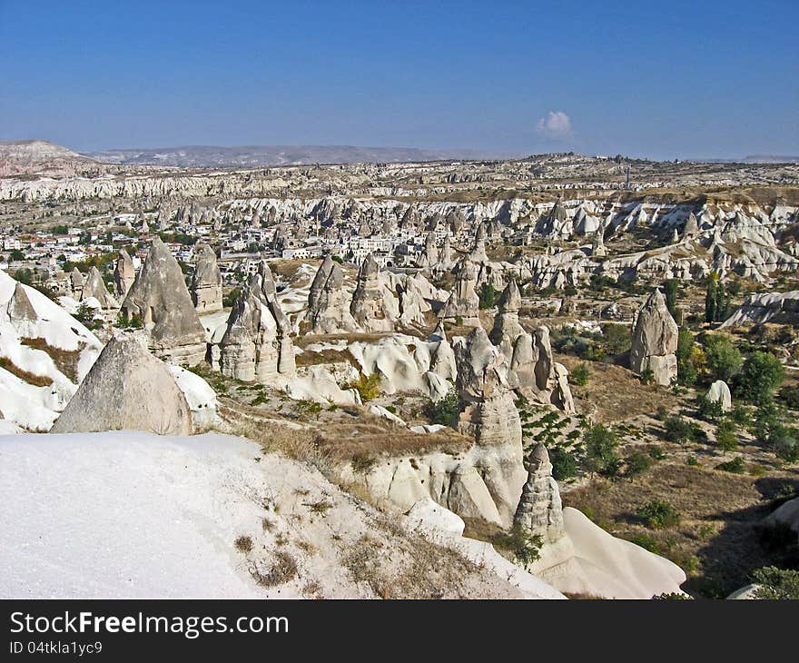 Landscape in Cappadocia (Turkey), a city almost hidden by fairy chimneys. Landscape in Cappadocia (Turkey), a city almost hidden by fairy chimneys