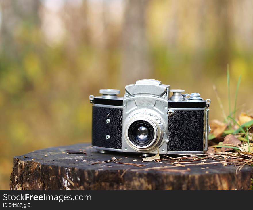 Old Camera On A Tree Stump