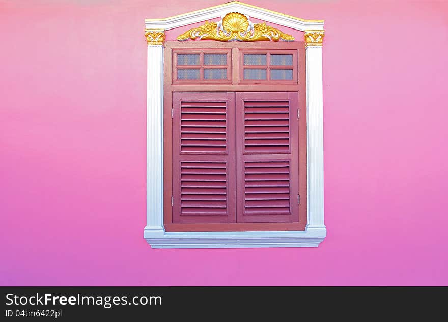 Old wood windows on pink wall