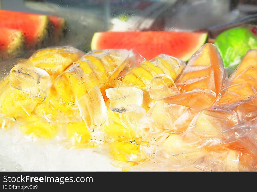 Fruit in the ice, Pineapple, Watermelon and cantaloupe melon. Fruit in the ice, Pineapple, Watermelon and cantaloupe melon