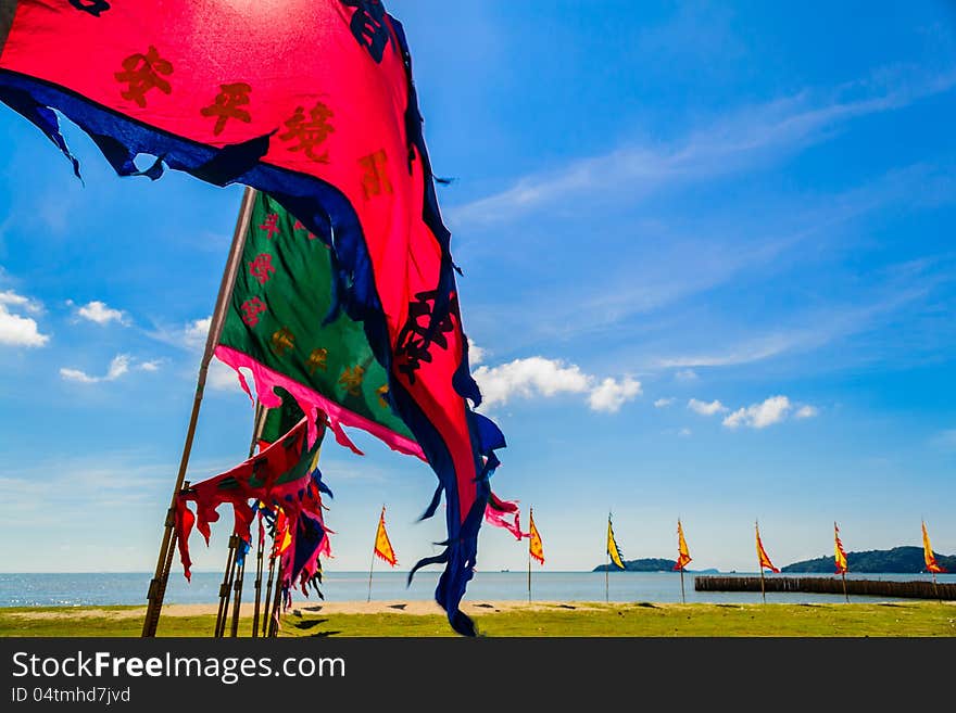 Many of holy flag are sitting on the beach before vegetarian fastival is start, Phuket