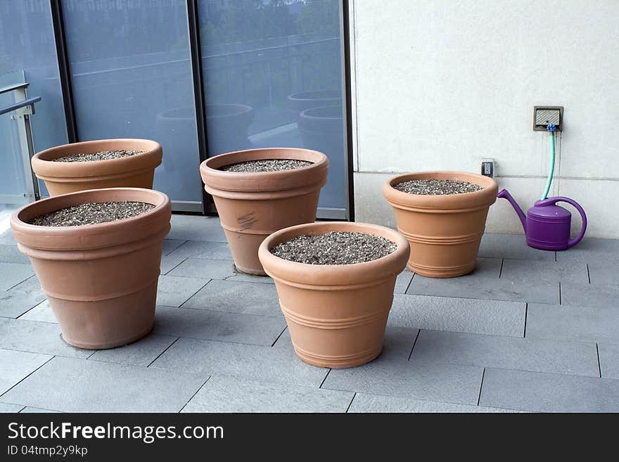 Seeding In Clay Pots On Balcony