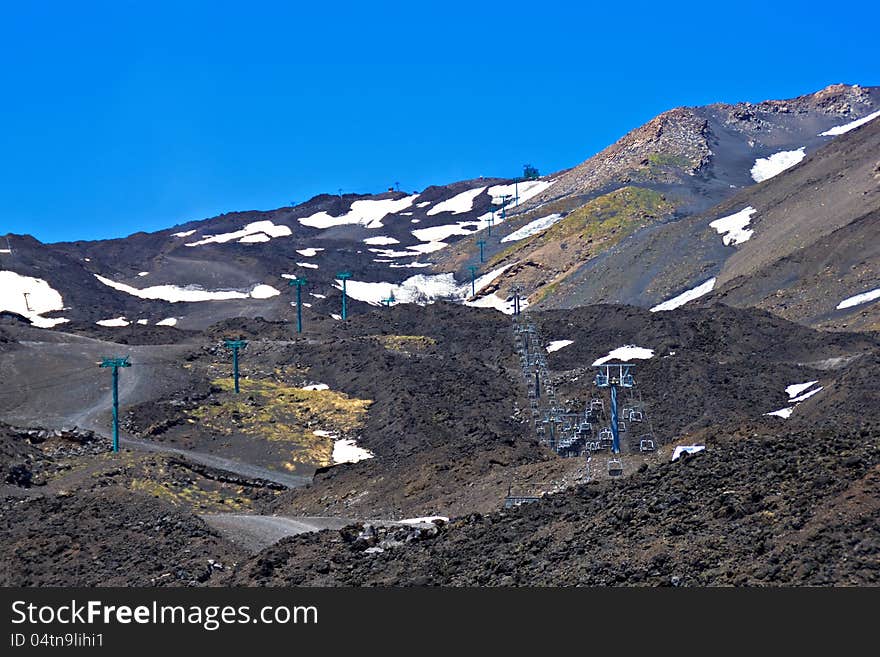Chair ski-lift for skiers on the volcano Etna. Chair ski-lift for skiers on the volcano Etna