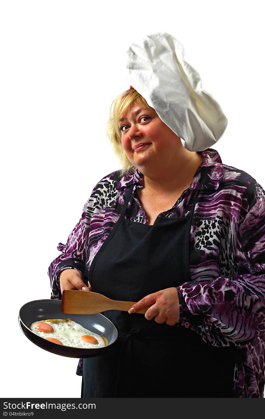 Cute plump woman in a chef's hat offers fried eggs on the pan. Cute plump woman in a chef's hat offers fried eggs on the pan