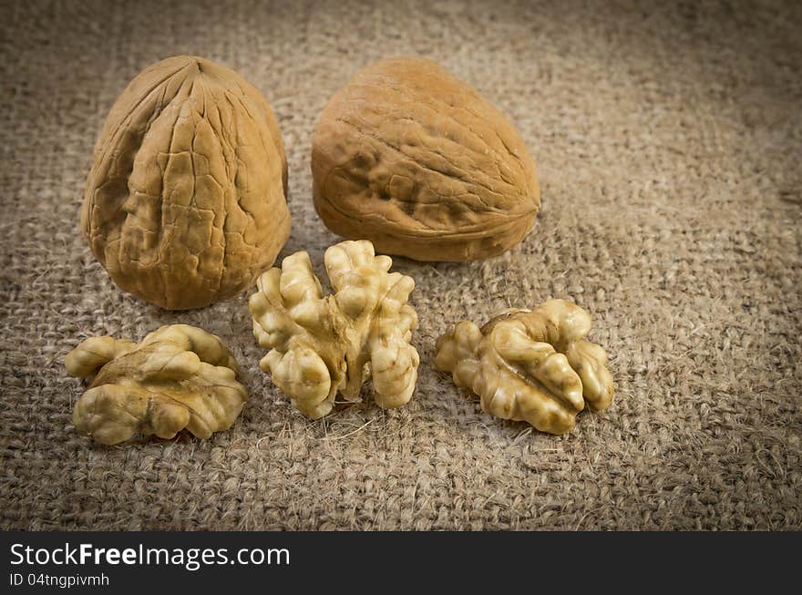 Some nuts , walnuts on sack texture