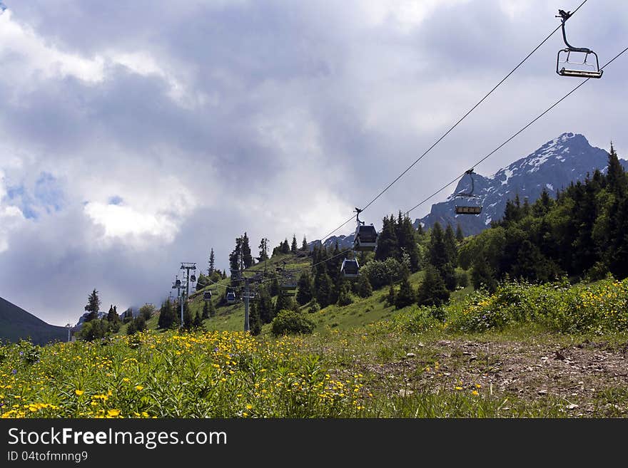 Ropeway in mountain Shymbulak under cloudy sky in Kazakhstan, Almaty. Ropeway in mountain Shymbulak under cloudy sky in Kazakhstan, Almaty