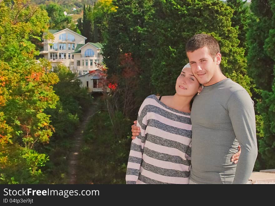 Young couple on the background of a beautiful home