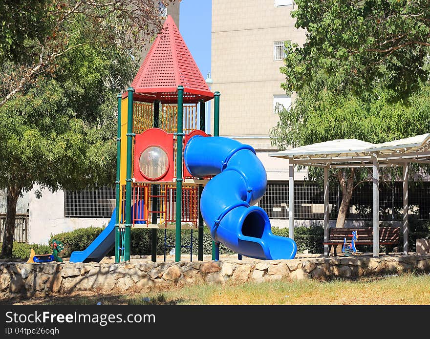 Modern children playground in park in a residential area. Modern children playground in park in a residential area