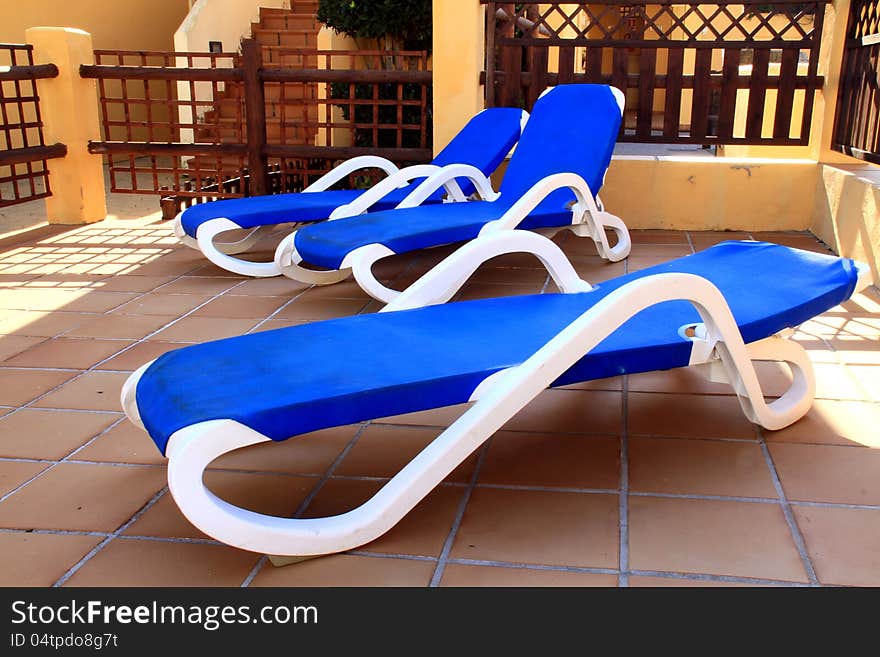 Image of deckchairs within a hotel area