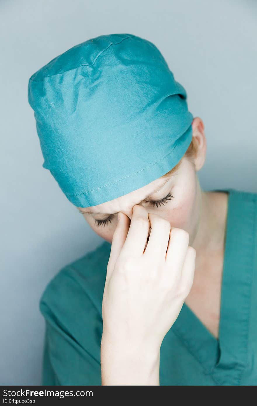 Nurse having a big headache
studio shot