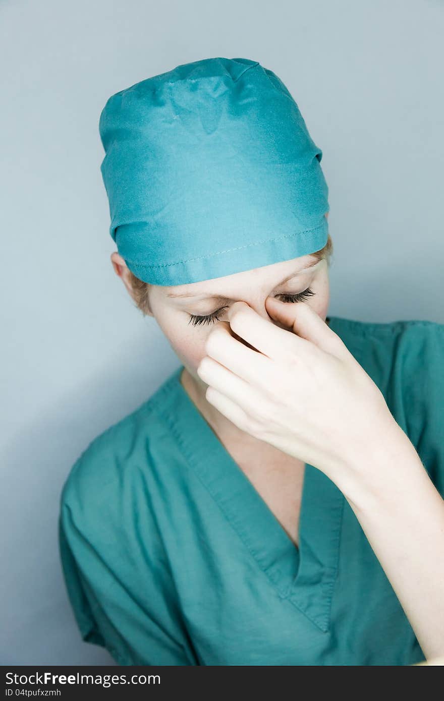 Nurse having a big headache
studio shot