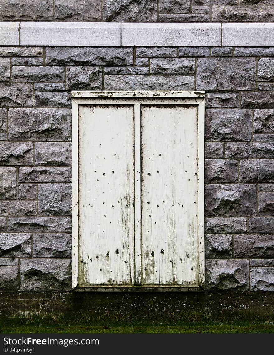 Beige Door in a stone wall.