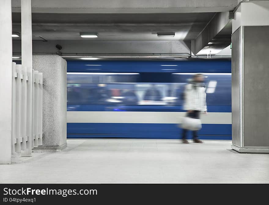 Someone waiting the metro. A long exposure of the wagon that show the movements and a blurry men just standing there. Someone waiting the metro. A long exposure of the wagon that show the movements and a blurry men just standing there.