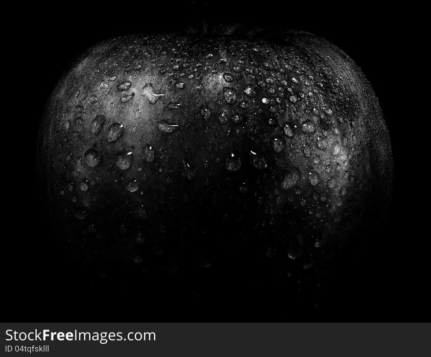 The apple on a black background