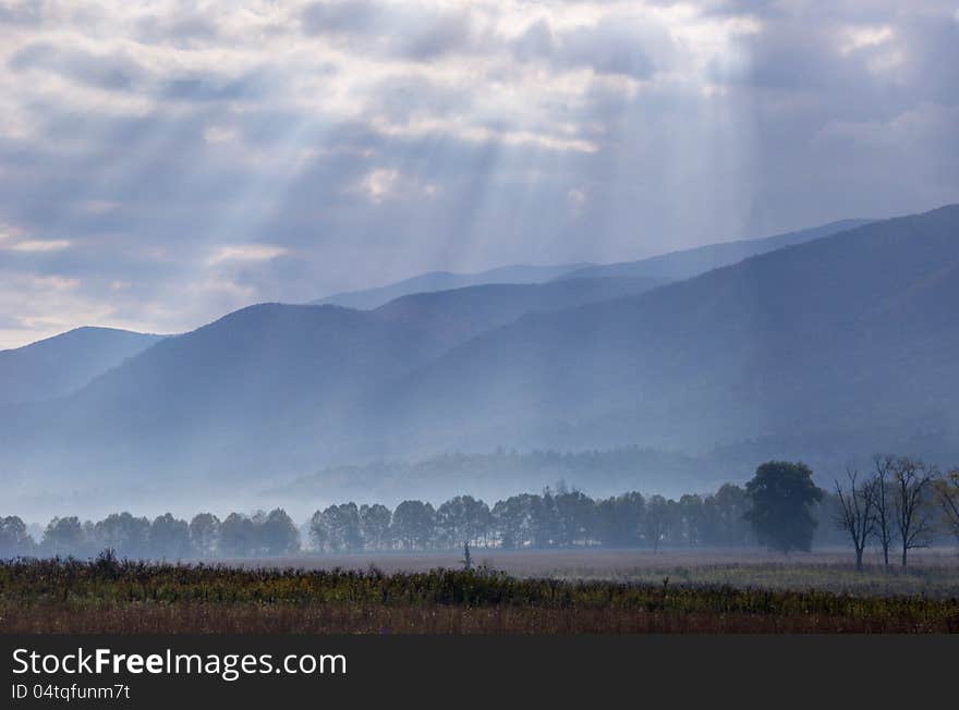 Sunrays cover the open fields of Cades Cove.