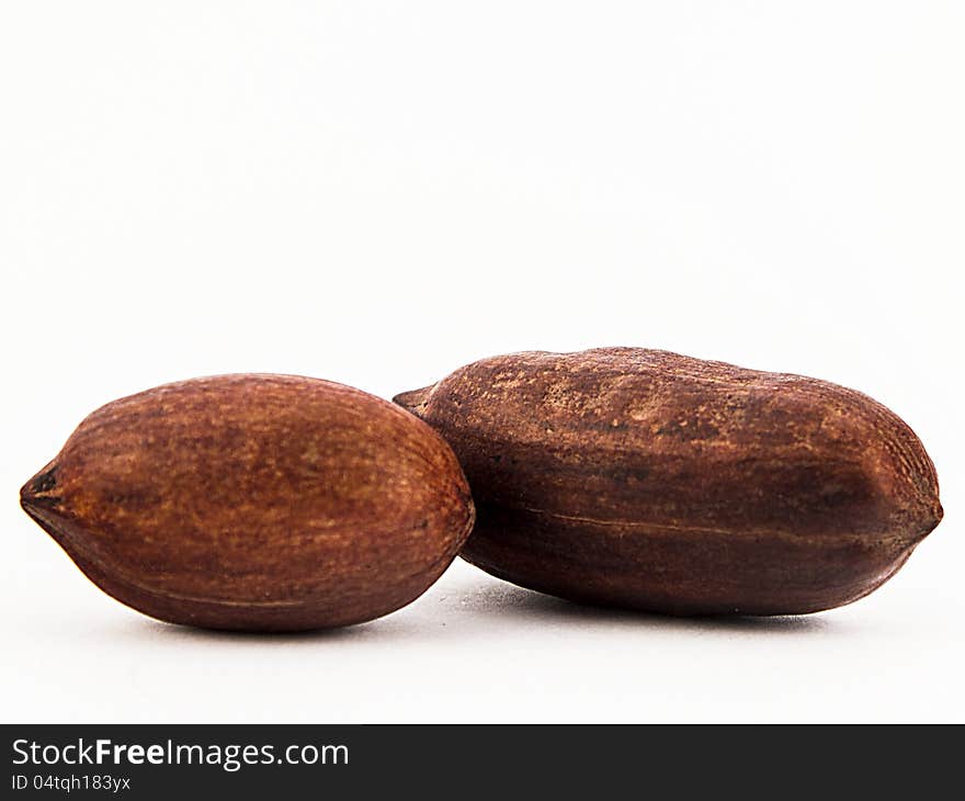 Assorted whole nuts - walnuts, pecans - on white background. Assorted whole nuts - walnuts, pecans - on white background