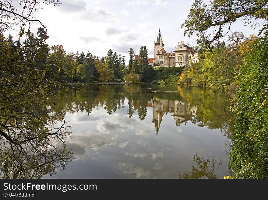 Průhonice park and castle with reflection in the water in the fall. Průhonice park and castle with reflection in the water in the fall