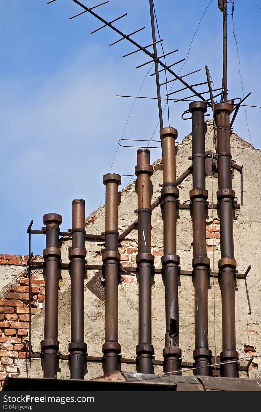 A multitude of Chimney in a building of a small factory in Bucharest, Romania