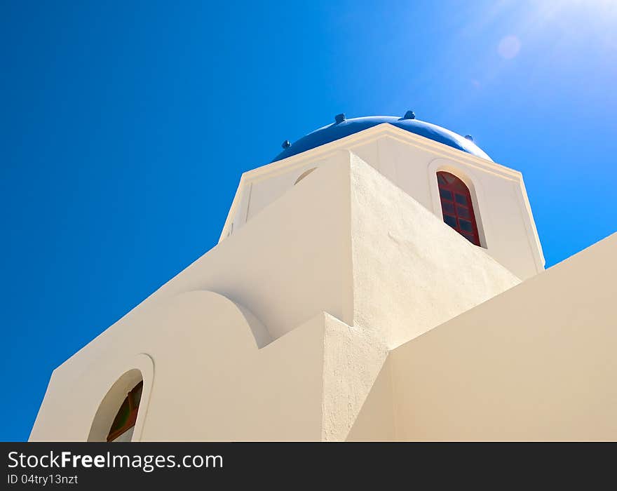 The white walls of the Christian Church are directed upwards, on a background of blue sky. The white walls of the Christian Church are directed upwards, on a background of blue sky.