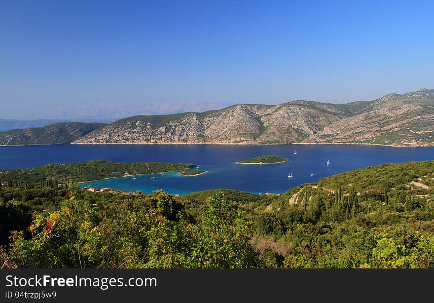 Korcula island near kneze in the Adriatic Sea : the Dubrovnik-Neretva County of Croatia. It lies just off the Dalmatian coast. View from a small road near Kneze. Korcula island near kneze in the Adriatic Sea : the Dubrovnik-Neretva County of Croatia. It lies just off the Dalmatian coast. View from a small road near Kneze.