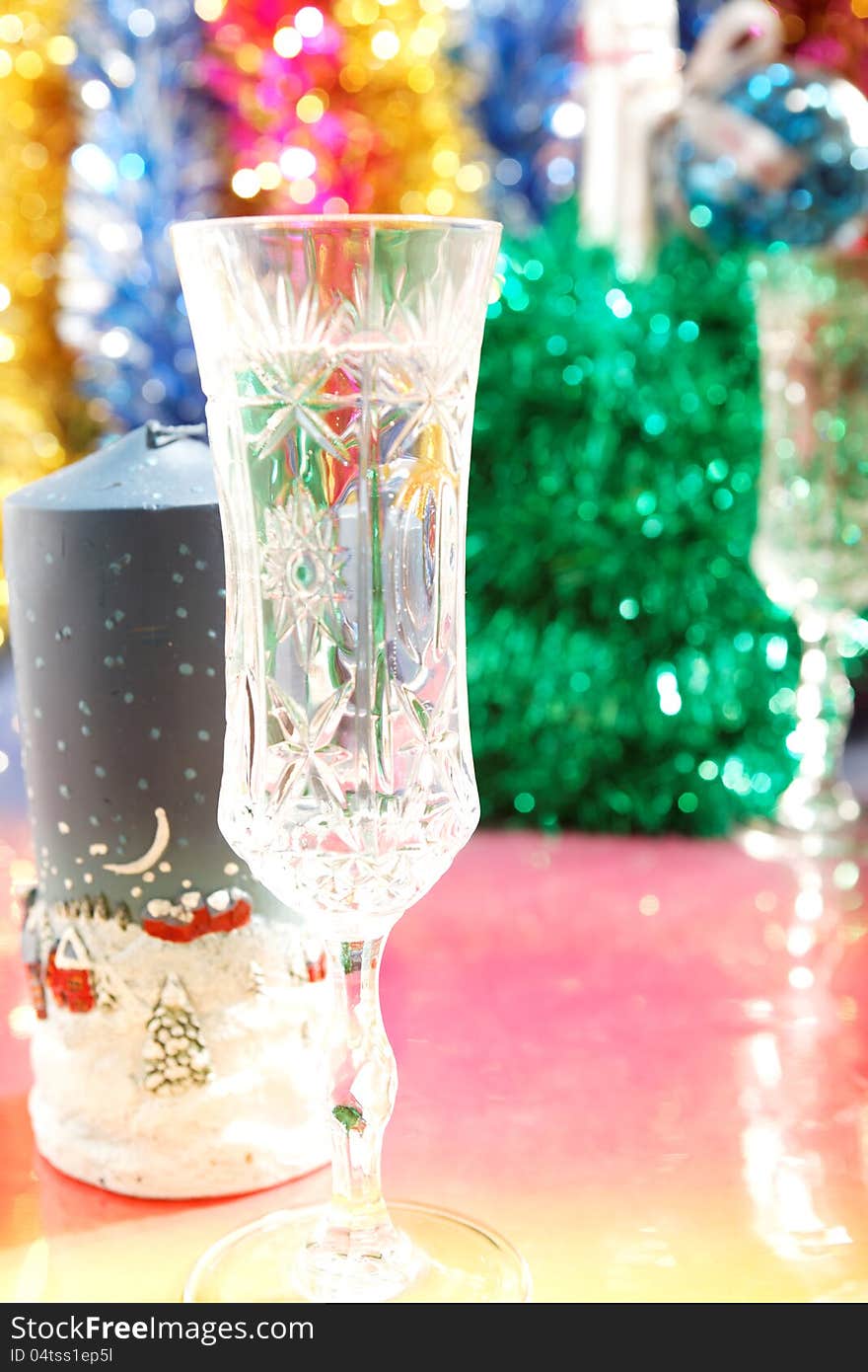 Festive glasses and a candle on the Christmas