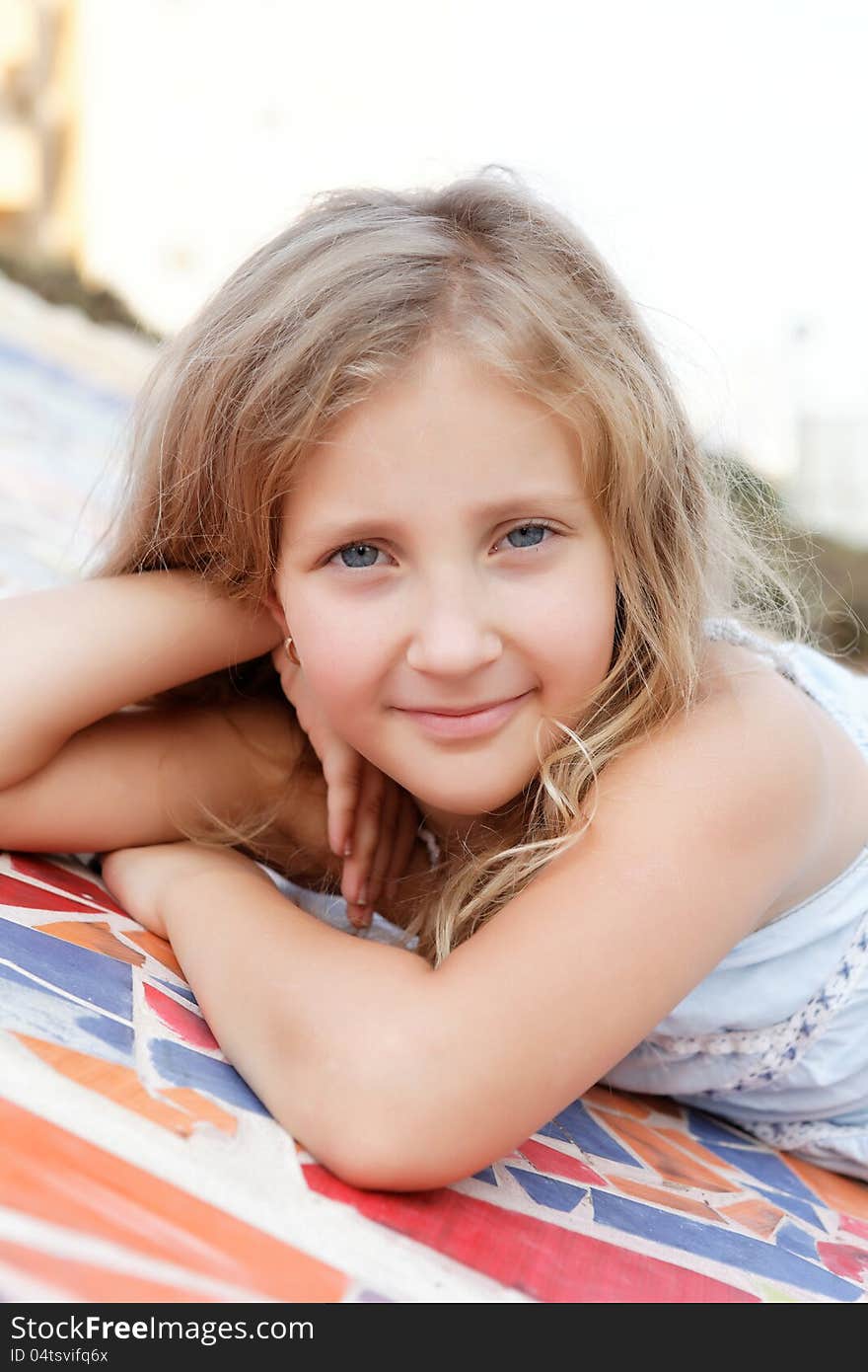 Portrait of a cute girl in summer day