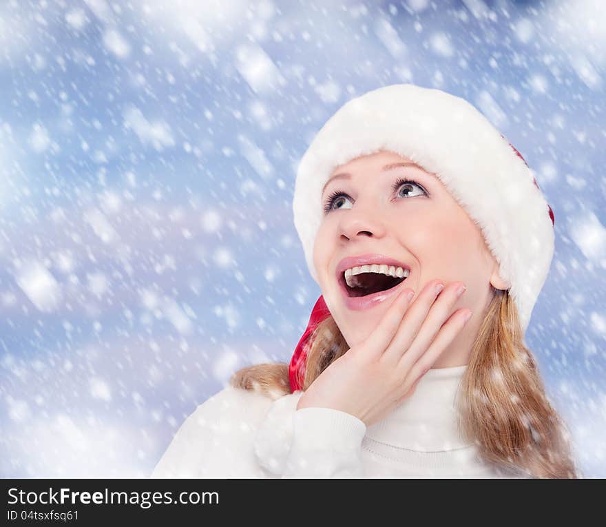 Happy funny girl in a Christmas hat