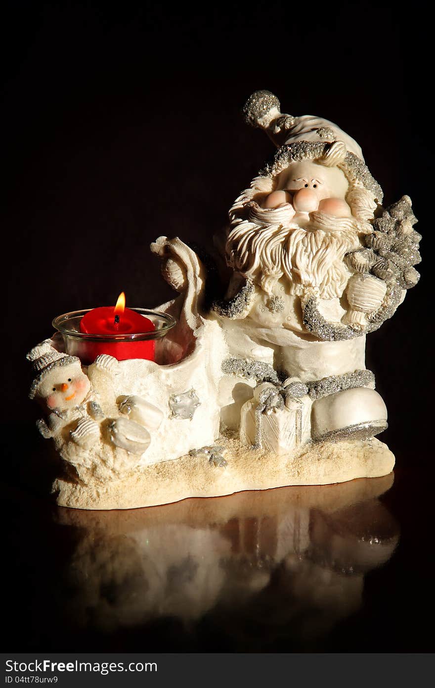 Original candlestick in the form of Santa Claus and snowman. Original candlestick in the form of Santa Claus and snowman