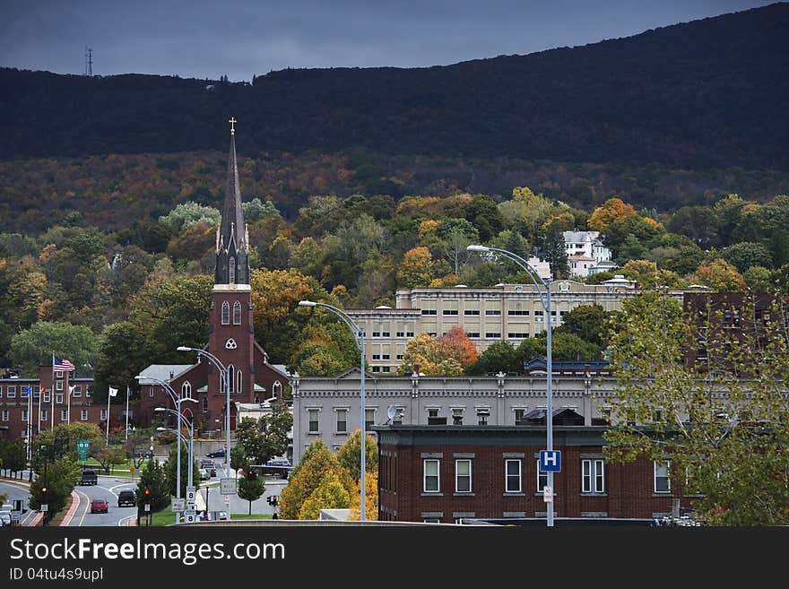 Church and cityscape in Autumn, under upcoming storm, North Adam Massachusetts. Church and cityscape in Autumn, under upcoming storm, North Adam Massachusetts