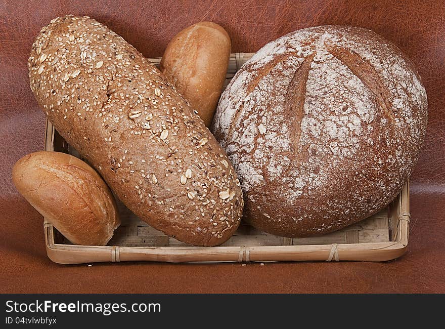 Group of different types of bread against a dark background