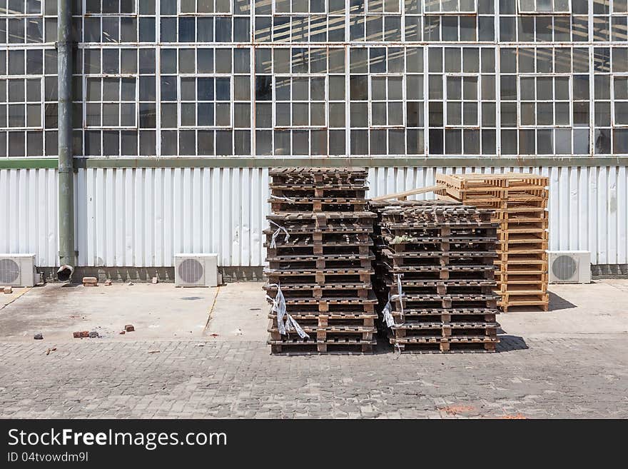 Crates outside factory in industrial setting - landscape exterior