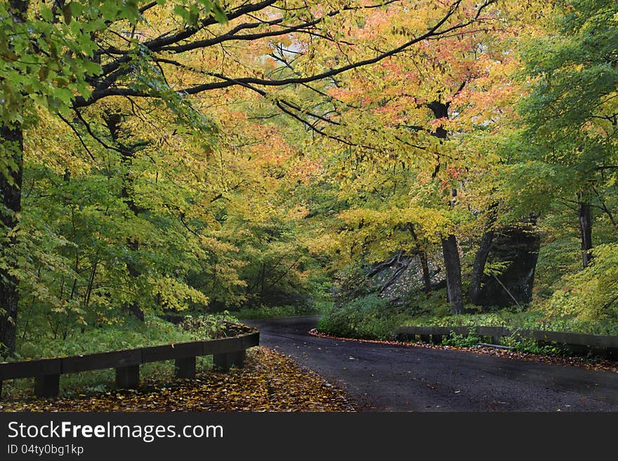 Raod leads to nowhere in Autumn Foliage, near Smugglers Notch, Stowe, Vermont. Raod leads to nowhere in Autumn Foliage, near Smugglers Notch, Stowe, Vermont