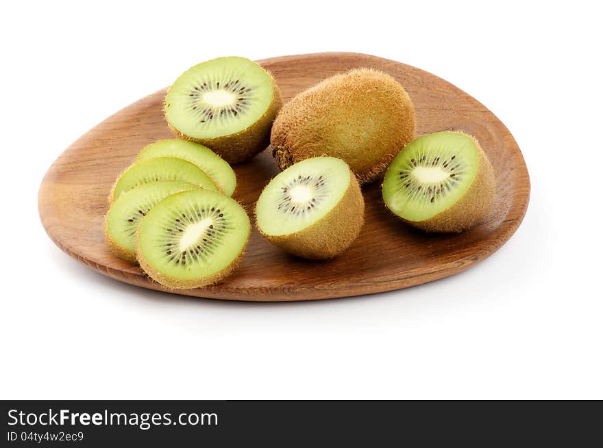 Kiwi On Wooden Plate