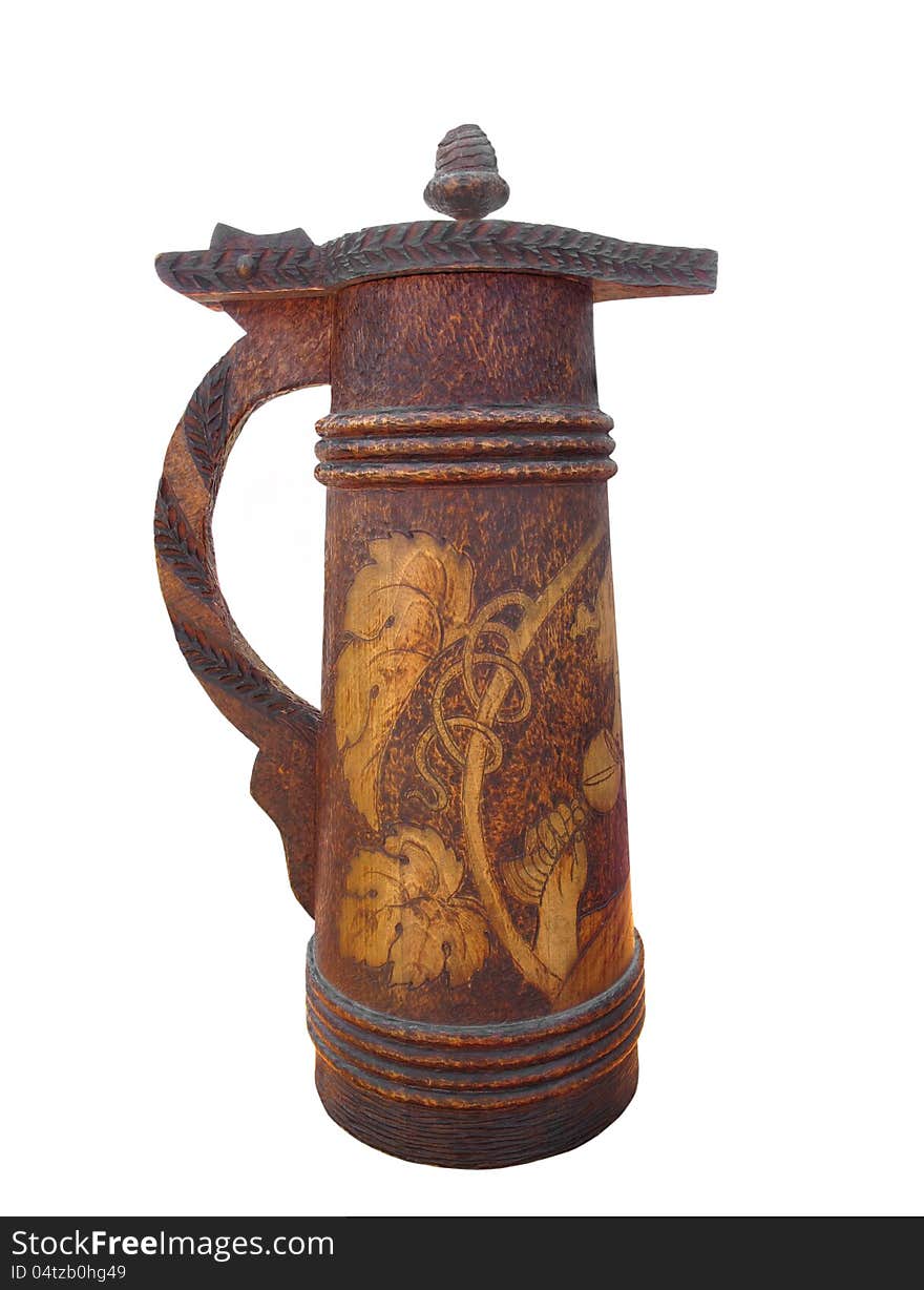 Old carved wooden beer stein isolated.