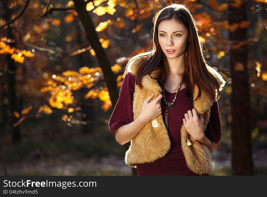 Beautiful autumn girl smiling