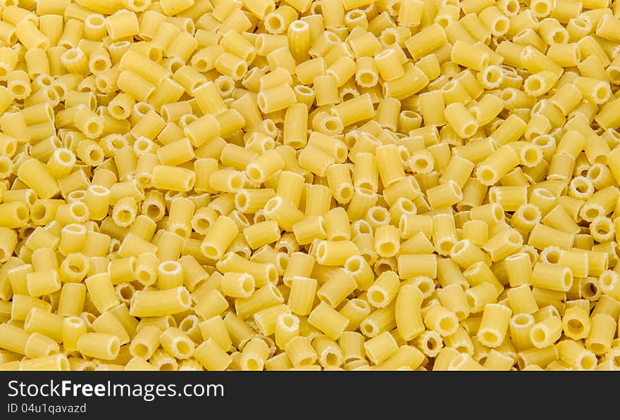 Yellow macaroni as background close up. Yellow macaroni as background close up