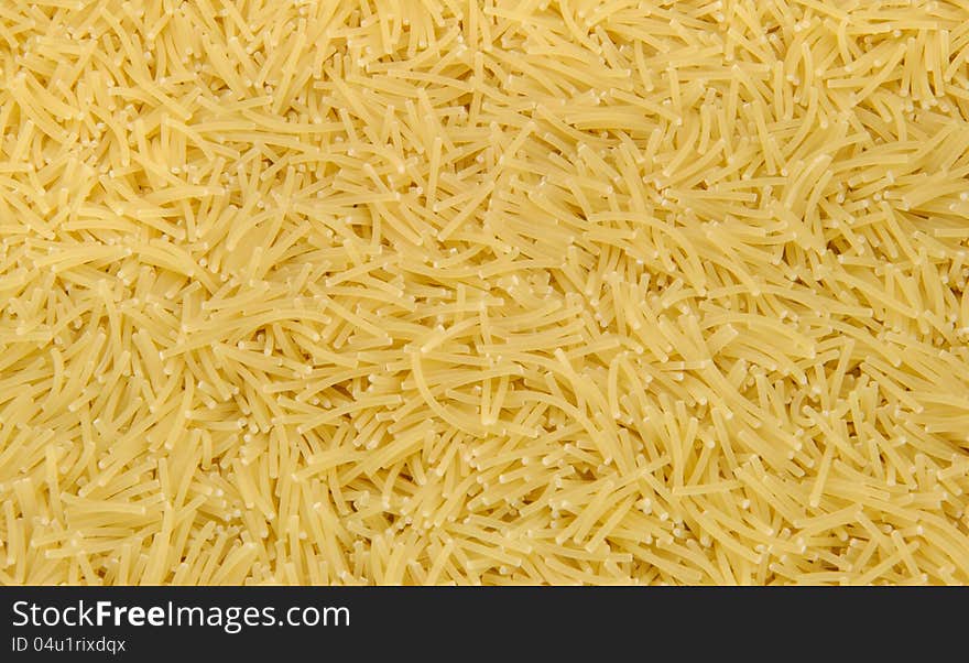 Scattered short cut noodles background. Scattered short cut noodles background