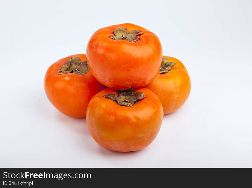 Persimmons close up, with white background